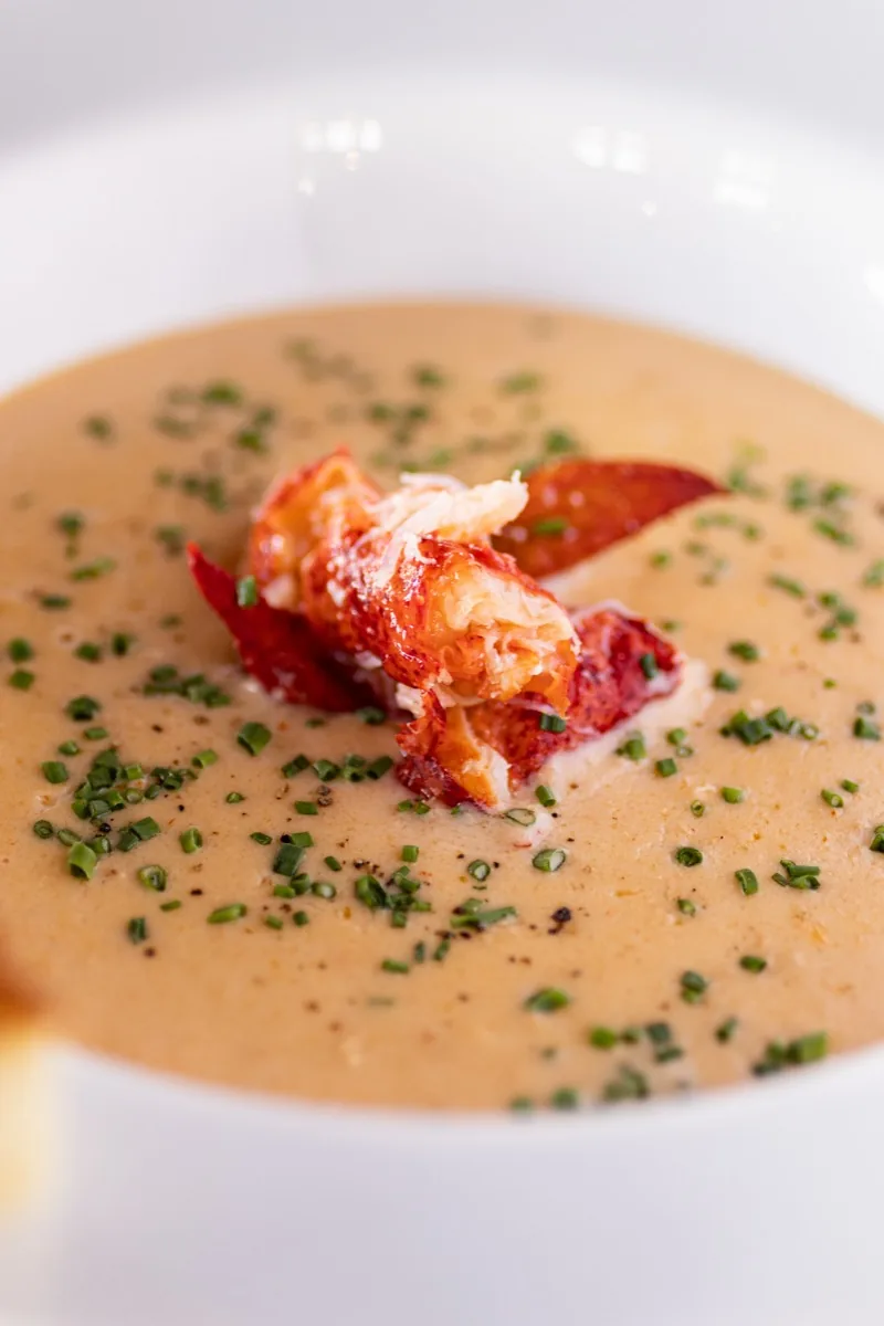 Lobster bisque topped with lobster claw meat and chives
