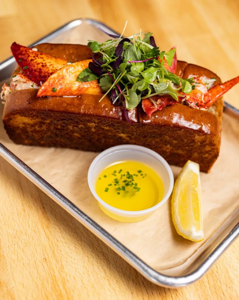Lobster roll with drawn butter and lemon